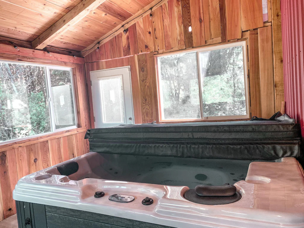 A hot tub in the middle of a room.